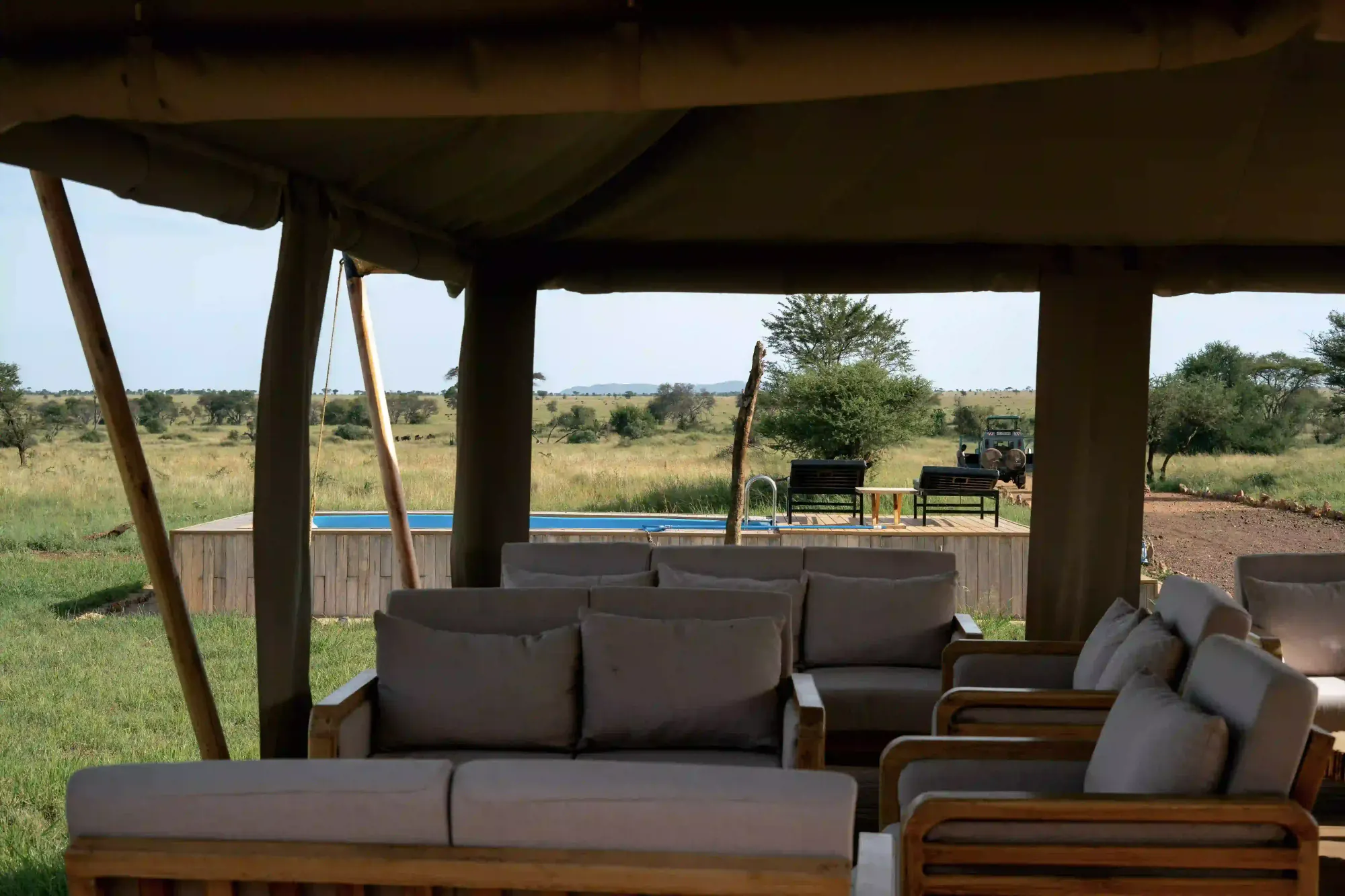 A private pool deck and lounge — the exclusive space a villa or private camp gives a group.