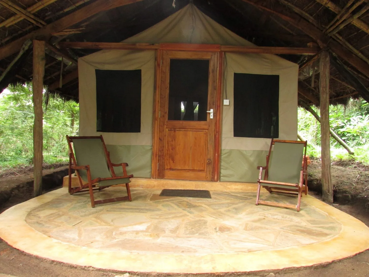 En-suite tent under its thatched shelter